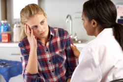 young teen having a consultation with her pscyhiatrist