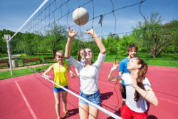 teens playing volleyball